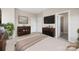 Bedroom featuring large windows and wooden furniture at 9223 Belcaro Ln, Charlotte, NC 28273