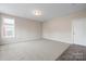 Bright, carpeted bedroom with ample natural light and neutral wall color at 9223 Belcaro Ln, Charlotte, NC 28273