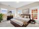 Bedroom featuring large windows and a wooden bed frame at 9223 Belcaro Ln, Charlotte, NC 28273