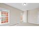 Bright bedroom with two large windows and neutral walls at 9223 Belcaro Ln, Charlotte, NC 28273