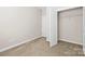 Bedroom featuring neutral walls and a closet for ample storage at 9223 Belcaro Ln, Charlotte, NC 28273