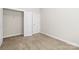 Carpeted bedroom with closet at 9223 Belcaro Ln, Charlotte, NC 28273