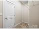 Walk-in closet with shelving and carpeted floor at 9223 Belcaro Ln, Charlotte, NC 28273