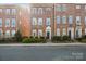 Charming brick townhome features a classic design with well-maintained landscaping at 9223 Belcaro Ln, Charlotte, NC 28273