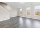 Bright living room showcasing neutral walls and a staircase to the second floor at 9223 Belcaro Ln, Charlotte, NC 28273