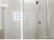 Modern tiled shower with glass enclosure and chrome fixtures at 9223 Belcaro Ln, Charlotte, NC 28273