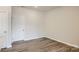 Simple spare bedroom with hardwood floors and neutral walls at 9858 Old Garden Cir, Gastonia, NC 28056