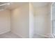 Large walk-in closet with double hanging rods and window at 9858 Old Garden Cir, Gastonia, NC 28056