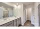 Double vanity bathroom with gray cabinets and quartz countertops at 9862 Old Garden Cir, Gastonia, NC 28056