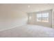 Spacious bedroom with plush carpeting and large windows offering natural light at 9862 Old Garden Cir, Gastonia, NC 28056