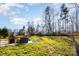 Spacious backyard with patio and seating area, offering ample outdoor space at 11618 Macallano Dr, Charlotte, NC 28215