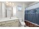 Full bathroom with single vanity and shower/tub combo at 11618 Macallano Dr, Charlotte, NC 28215