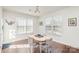 Bright breakfast nook with light wood table and gray chairs at 11618 Macallano Dr, Charlotte, NC 28215