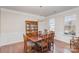 Formal dining room with hardwood floors and traditional furniture at 11618 Macallano Dr, Charlotte, NC 28215