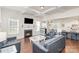 Living room with kitchen views, fireplace and hardwood floors at 11618 Macallano Dr, Charlotte, NC 28215