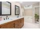 Elegant bathroom with double vanity, marble countertop, and skylight at 126 Tall Pines Ct, Lake Wylie, SC 29710