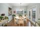 Breakfast nook with white table and access to backyard at 12612 Longford Crossing Pl, Huntersville, NC 28078