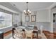 Bright dining room featuring a chandelier, wainscoting, and a bay window at 12749 Netherhall Dr, Charlotte, NC 28269