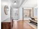 Bright dining room with hardwood floors, large windows, and a farmhouse table at 130 W Warfield Dr, Mooresville, NC 28115