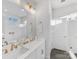 Double vanity bathroom with white cabinets and gold fixtures at 1302 Nandina St, Charlotte, NC 28205