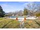 Spacious backyard featuring a pool, hot tub, and beautifully landscaped grounds at 13031 Westmoreland Farm Rd, Davidson, NC 28036