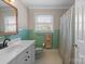 Bathroom featuring tile accents and a shower and tub combination at 13031 Westmoreland Farm Rd, Davidson, NC 28036