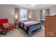 Bedroom with multiple windows and wooden furnishings at 13031 Westmoreland Farm Rd, Davidson, NC 28036