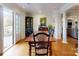 Dining room with hardwood floors, natural light, and seating for six at 13031 Westmoreland Farm Rd, Davidson, NC 28036