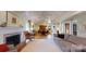 A living room area has a fireplace, hardwood floors, and a white area rug at 13031 Westmoreland Farm Rd, Davidson, NC 28036
