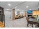 Finished basement with living room, fireplace, wood-look floors, and finished support beams at 13031 Westmoreland Farm Rd, Davidson, NC 28036
