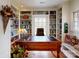 The office has custom built-in shelving, hardwood floors, and a dark wood desk at 13031 Westmoreland Farm Rd, Davidson, NC 28036