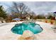 Backyard pool with spa, sundeck, and lush landscaping creating a private oasis at 13031 Westmoreland Farm Rd, Davidson, NC 28036