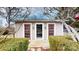 Charming pool house exterior featuring cottage style doors, with a cozy interior at 13031 Westmoreland Farm Rd, Davidson, NC 28036