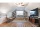 Spacious bonus room with built-in shelving and a daybed at 13328 Caite Ridge Rd, Davidson, NC 28036