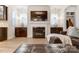 Modern fireplace with dark cabinetry and a large TV above at 13328 Caite Ridge Rd, Davidson, NC 28036