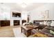 Living room with fireplace, large TV, and leather sectional sofa at 13328 Caite Ridge Rd, Davidson, NC 28036