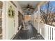 Spacious front porch with rocking chairs and ceiling fans, perfect for relaxing outdoors at 14111 Garden District Row, Huntersville, NC 28078