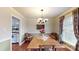 Dining room with hardwood floors, chandelier, and built-in hutch at 14122 Honeysuckle Ridge Dr, Matthews, NC 28105