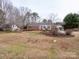 Brick ranch home with mature trees and lawn at 14122 Honeysuckle Ridge Dr, Matthews, NC 28105