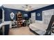 Comfortable bedroom with a ceiling fan and built-in shelving at 146 Weeping Spring Dr, Mooresville, NC 28115