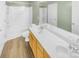 Bathroom boasts double sinks, wood cabinets, and a large bathtub at 17015 Greenlawn Hills Ct, Charlotte, NC 28213