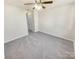 Spacious bedroom with carpet flooring and ceiling fan at 17015 Greenlawn Hills Ct, Charlotte, NC 28213