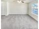 Spacious carpeted bedroom with ample natural light and ceiling fan at 17015 Greenlawn Hills Ct, Charlotte, NC 28213