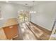 Bright dining area with wood-look flooring and sliding glass doors at 17015 Greenlawn Hills Ct, Charlotte, NC 28213