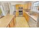 Modern kitchen with stainless steel appliances and light wood cabinets at 17015 Greenlawn Hills Ct, Charlotte, NC 28213
