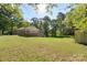 House with a large grassy backyard and screened porch at 1935 Berkshire Dr, Gastonia, NC 28052