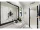 Clean bathroom with granite countertop, black framed mirror, and walk-in shower at 1935 Berkshire Dr, Gastonia, NC 28052