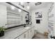 Modern bathroom with granite countertop, white cabinets, and patterned shower curtain at 1935 Berkshire Dr, Gastonia, NC 28052