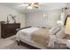 Bright bedroom with a queen bed, dresser, and neutral decor at 1935 Berkshire Dr, Gastonia, NC 28052