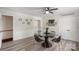 Charming dining area with glass-top table and four black chairs at 1935 Berkshire Dr, Gastonia, NC 28052